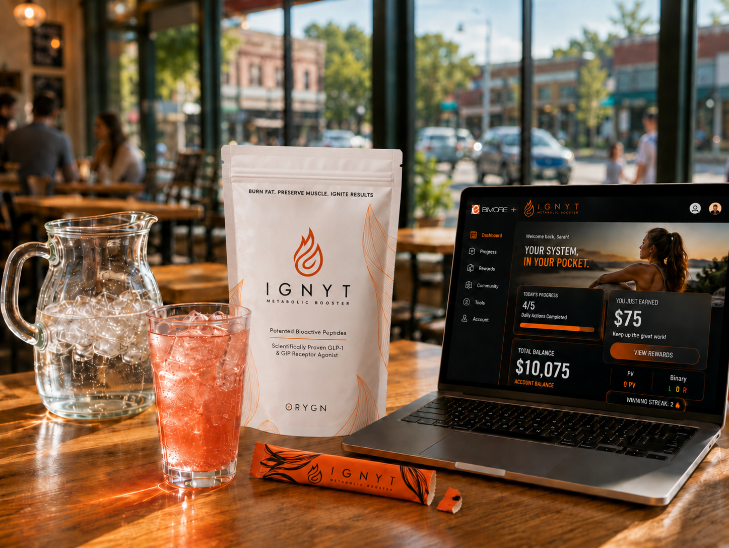 Distributor working from a coffee shop with a laptop and an IGNYT bag on the table