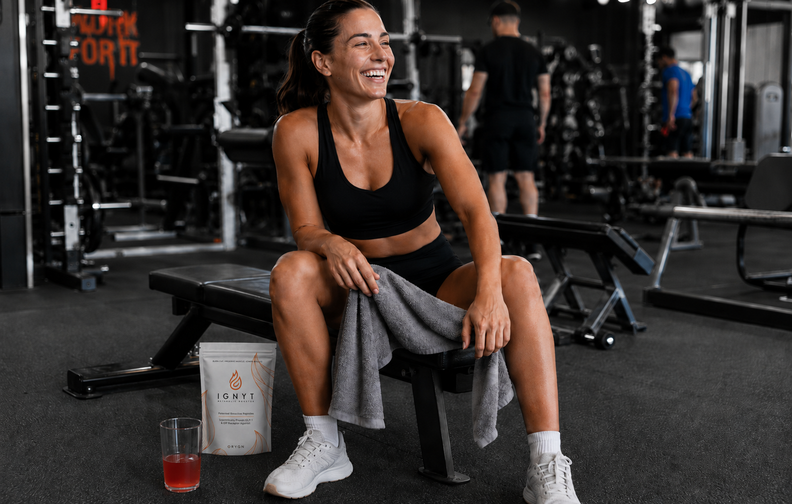 Woman in gym with IGNYT bag and glass